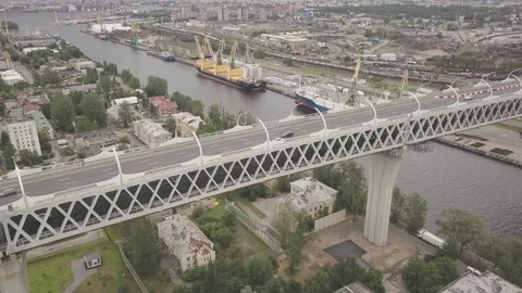 Moving along the double decker highway bridge over the canal or river Video stock 77837415