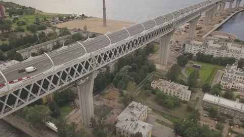 Moving along the double decker highway bridge over the buildings, sea and beach Video stock 77838999