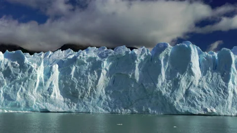 Moving along face of Perito Moreno glacier in Patagonia Stock Footage 131044099