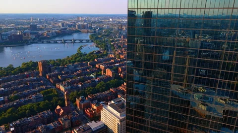 Moving along the glass facade of the skyscraper reflecting the cityscape. Stock Footage 339749888