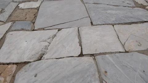 Moving Along The Old Stone Road With Large Slabs In The Ancient City Stock Footage 195930436