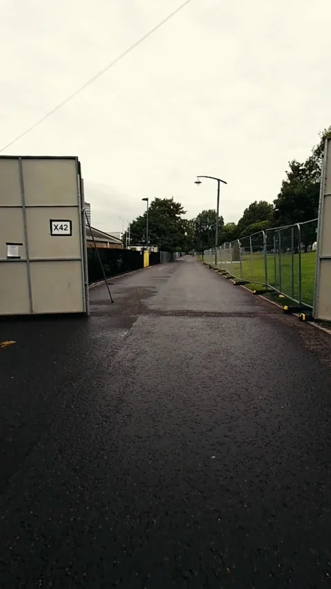 Moving along a path with large metal barriers Video stock 200400182