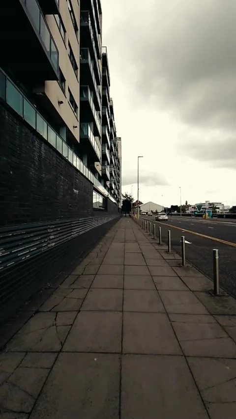 Moving along a sidewalk with cracks - Vertical Video Video stock 200401187