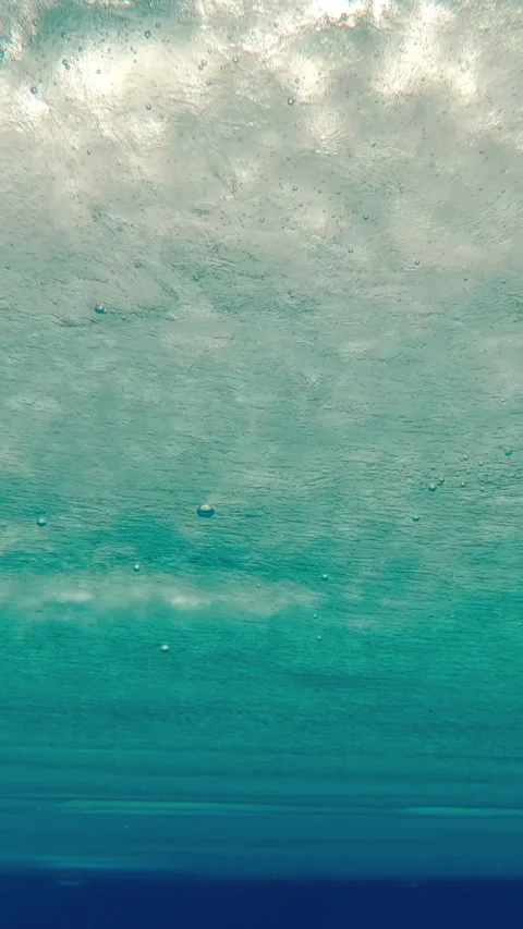 Moving along surface of solid layer of blue ice with air bubbles frozen in it Stock Footage 318834800