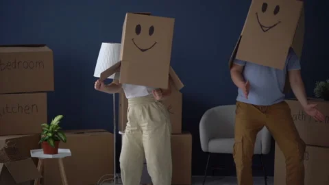 Moving and relocation concept. Packing and decluttering. Unrecognizable couple Stock Footage 155124954