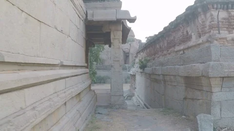 Moving around beautiful ancient temple in Hampi, India. Smooth tracking shot Stock Footage 83469381
