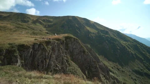 Moving around mountain valley with sun flare in summer day. outdoor green nature Video stock 121860171
