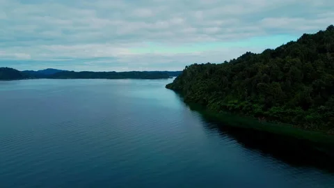 MOVING AROUND POINT ON LAKE Stock Footage 230994700