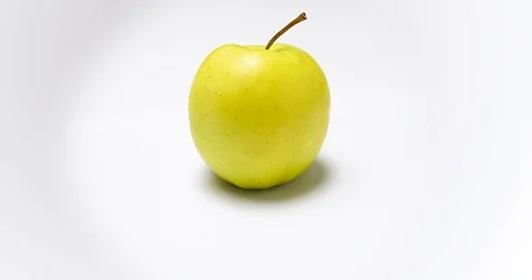 Moving around yellow apple Stock Footage 115951100