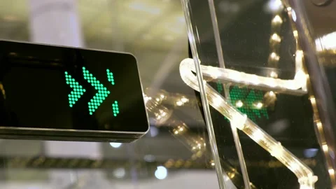 Moving arrows indicate to people direction of movement on the escalator. Stock Footage 132921921