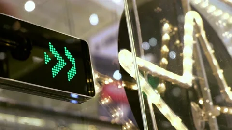 Moving arrows indicate to people direction of movement on the escalator. Video stock 138783743