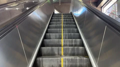 Moving Ascending Escalator Steps with Yellow Safety Line, Urban Transit Stock Footage 331208064