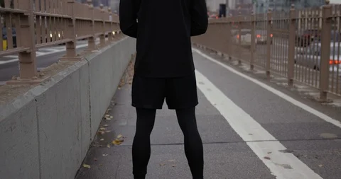 Moving Up To Athletic Runner Stretching For A Run On Classic New York Road  Stock Footage 112585517