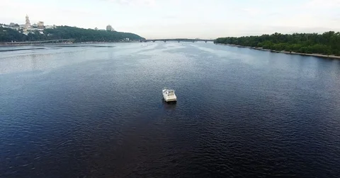 Moving back drone. View of the beautiful river Dnieper in Kyiv, Ukraine. Yacht Stock Footage 82657518