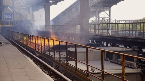 Moving back wagon with burning coke. Metallurgical plant Stock Footage 116772820