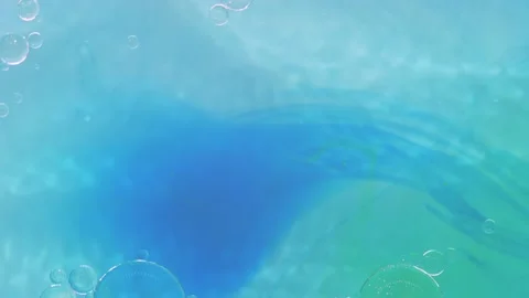 Moving background consisting of blue particles of the current paint on a white Stock Footage 200247258