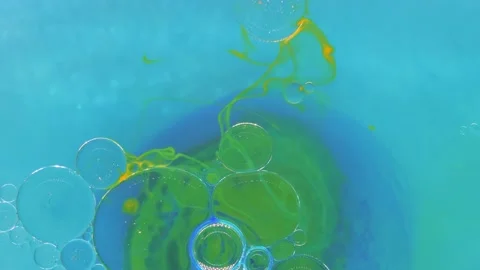 Moving background consisting of blue, yellow and green particles of the current Stock Footage 196185099