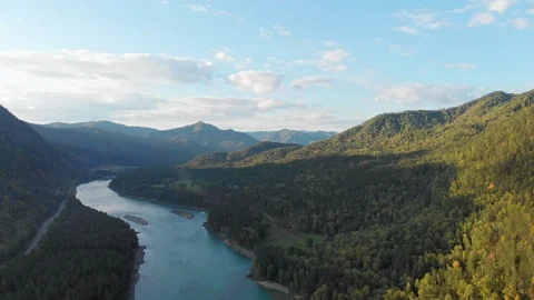 Moving backward over riverbed and mountain valley in summer day. Stock Footage 108288930