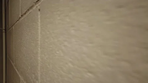 Moving Backwards Alongside Brick Wall In Basement Super Closeup Background B Stock Footage 154696492