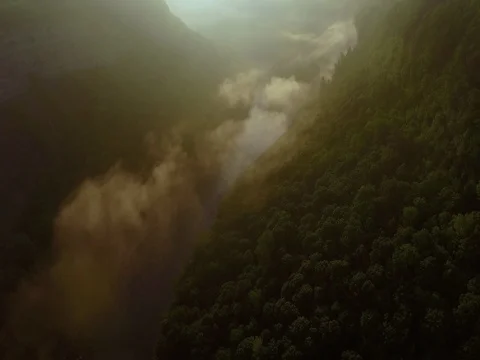 Moving backwards through a foggy river valley. Stock Footage 80741777