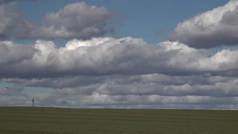 Moving beautiful clouds over a field Stock Footage 150678989