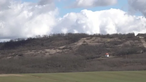 Moving beautiful clouds over a field Stock Footage 152994523