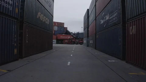 Moving between the containers at the sea port Stock-Footage 129639452