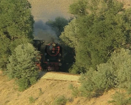 Moving black steam train and train whistle Stock Footage 8522553