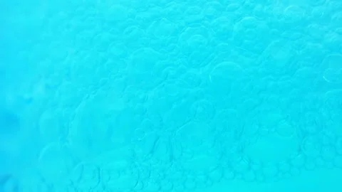 Moving blue bubbles background. Cosmetic micellar cleanser, macro shot. Stock Footage 275074961