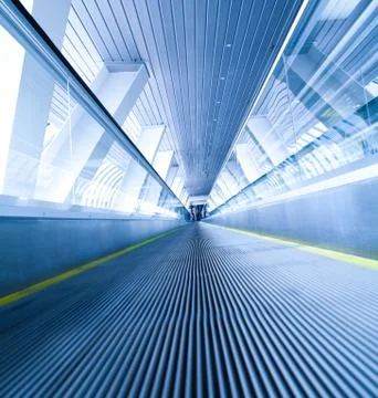 Moving blue escalator Stock Photos