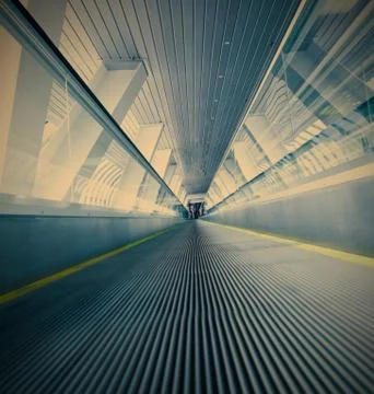 Moving blue escalator Foto stock
