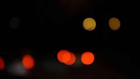 Moving bokeh circle. Blurred night traffic lights background. Stock Footage 108853857