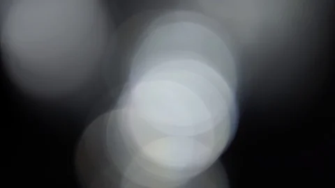 Moving bokeh, defocus, blur, blinking light on black background Stock Footage 119495646