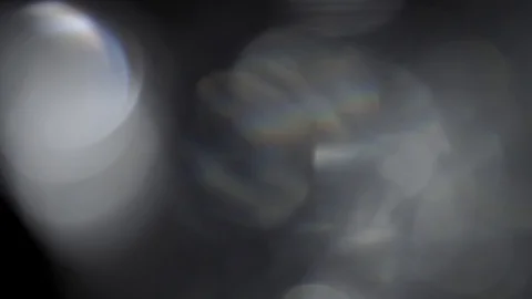 Moving bokeh, defocus, blur, blinking light on black background Видео 119495751