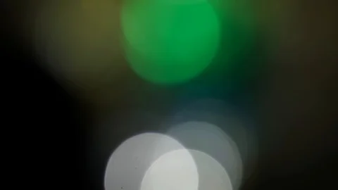 Moving bokeh, defocus, blur, blinking light on black background 스톡 동영상 119690125
