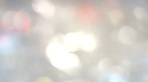 Moving bokeh lights, crossing frame, pastel colors, progressive blurring Stock Footage 64576687