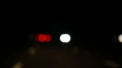 Moving bokeh seen from inside a car driving through the city. 動画素材 88511837