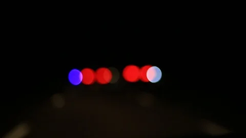 Moving bokeh seen from inside a car driving through the city. Vidéo 88512009