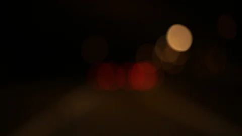 Moving bokeh seen from inside a car driving through the city. Vídeos de archivo 88512667
