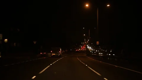 Moving bokeh seen from inside a car driving through the city. Stock-Footage 88513416