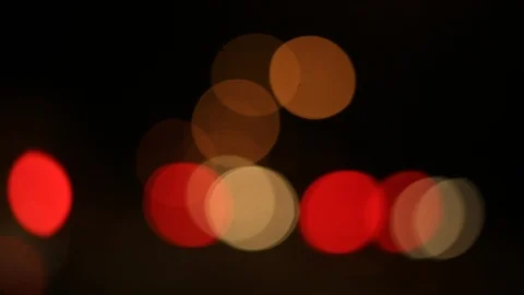 Moving bokeh seen from inside a car driving through the city. Stock-Footage 88513510