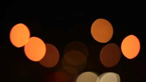 Moving bokeh seen from inside a car driving through the city. Видео 88513577
