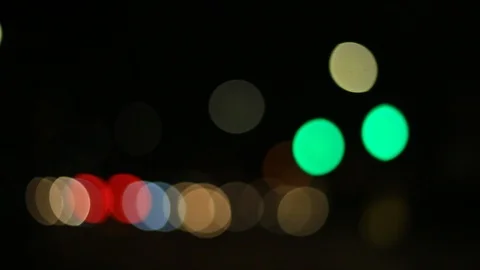 Moving bokeh seen from inside a car driving through the city. Stock Footage 88514081