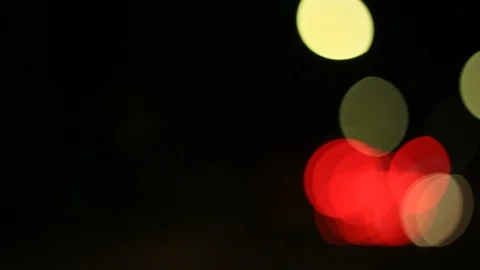 Moving bokeh seen from inside a car driving through the city. Video stock 88514528