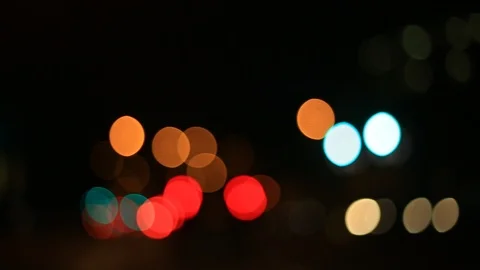 Moving bokeh seen from inside a car driving through the city. 動画素材 88514849