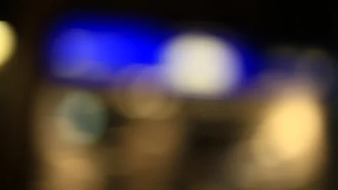 Moving bokeh seen from inside a car driving through the city. Видео 88514899