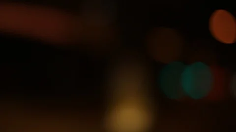 Moving bokeh seen from inside a car driving through the city. 動画素材 88514947