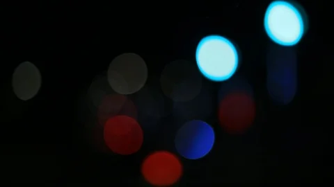 Moving bokeh seen from inside a car driving through the city. Vidéo 88514995