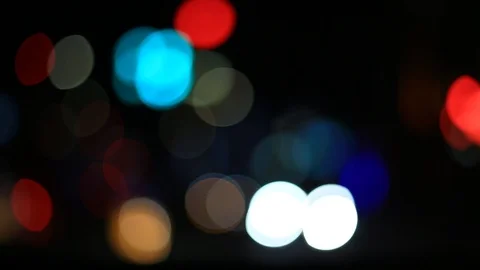 Moving bokeh seen from inside a car driving through the city. Vidéo 88515093