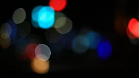 Moving bokeh seen from inside a car driving through the city. Stockbeeldmateriaal 88515163